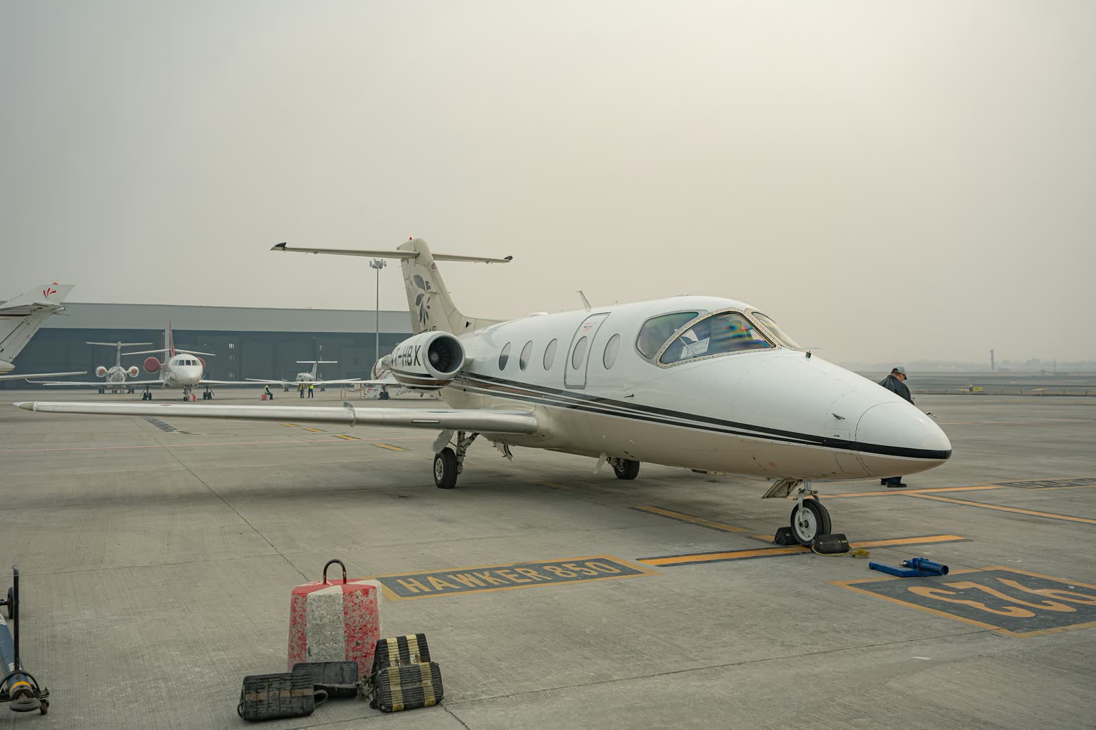 A private jet parked on the tarmac