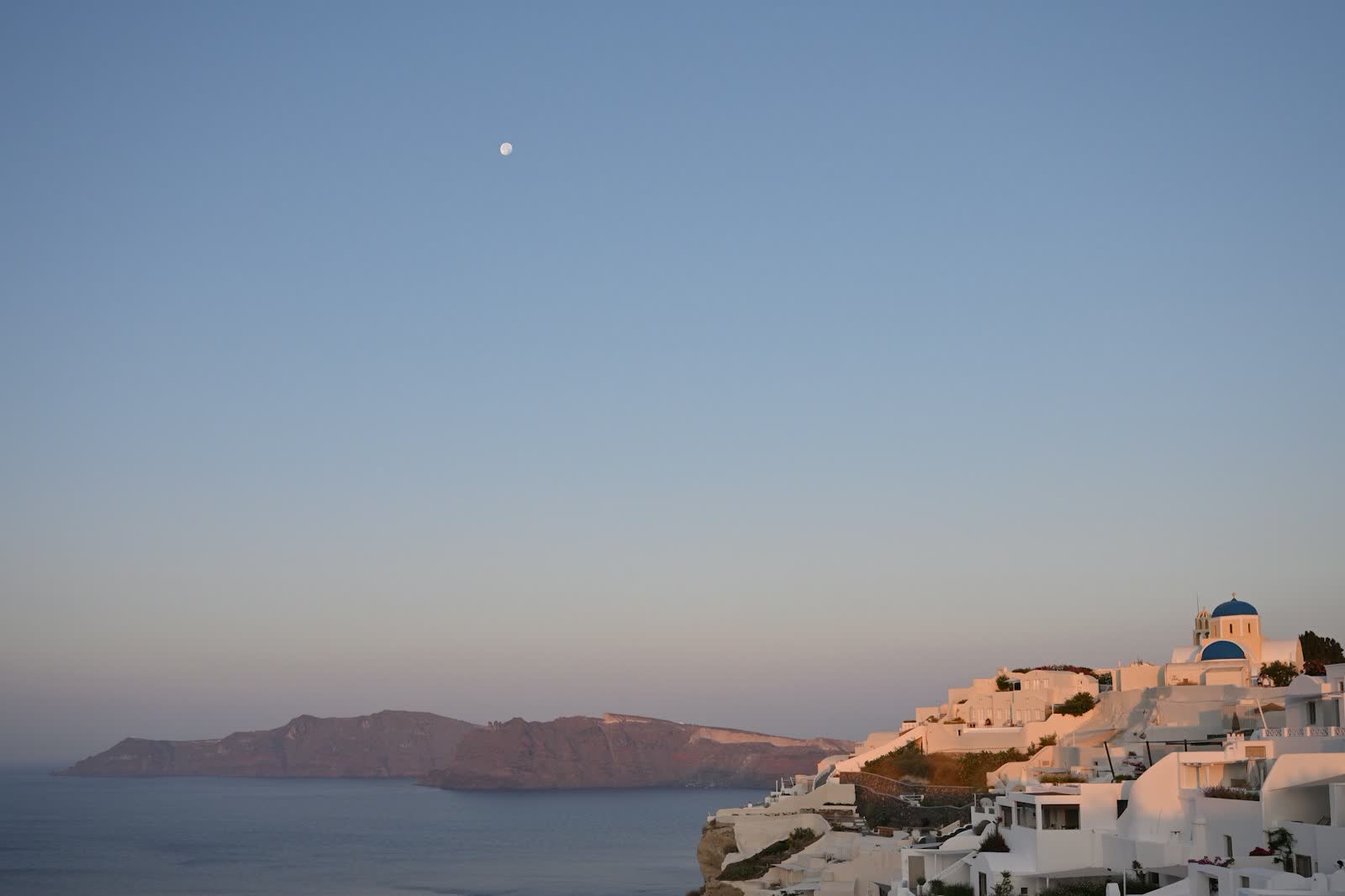 A white Greek island village above the Aegean