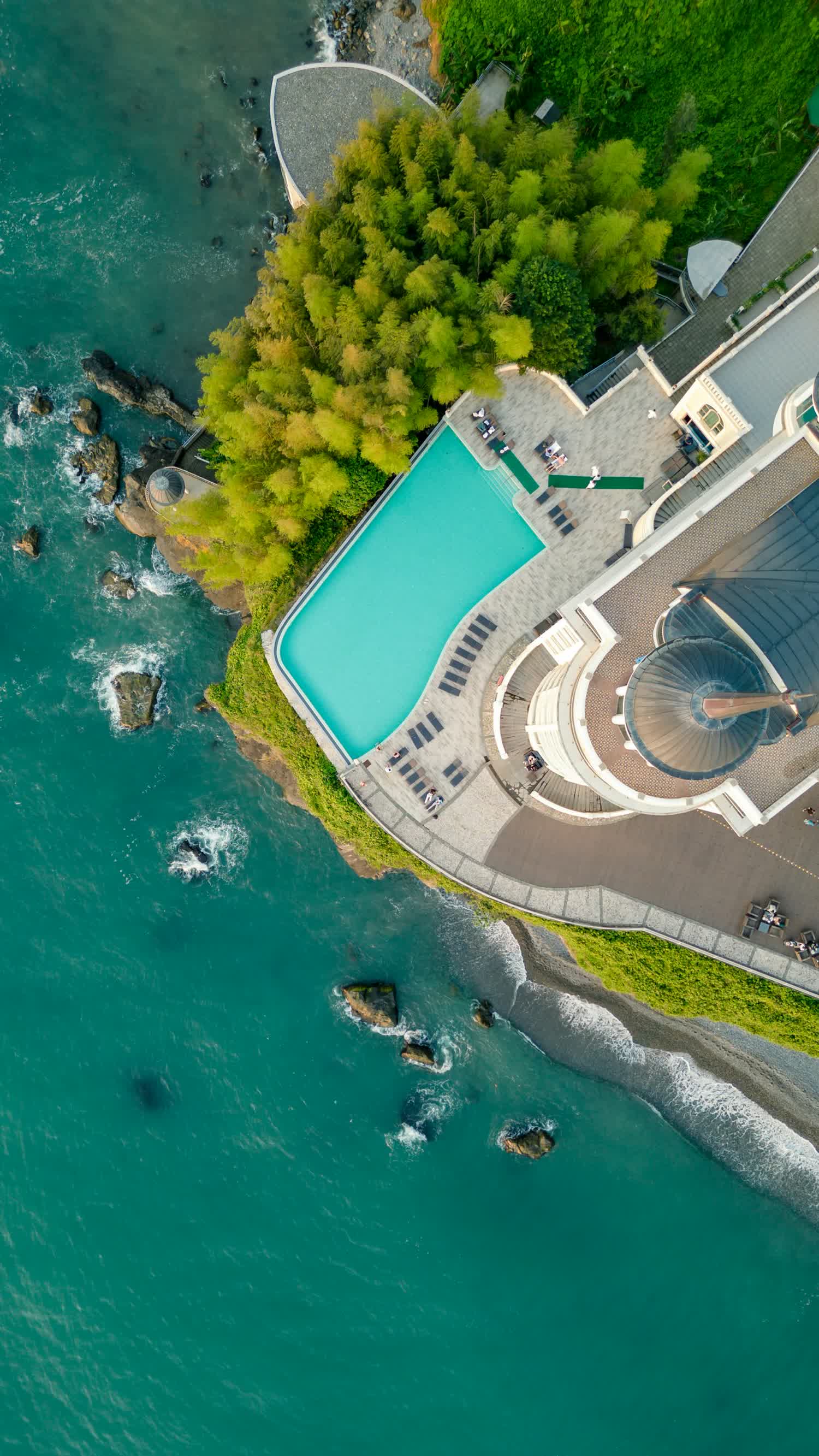 A resort pool overlooking the ocean